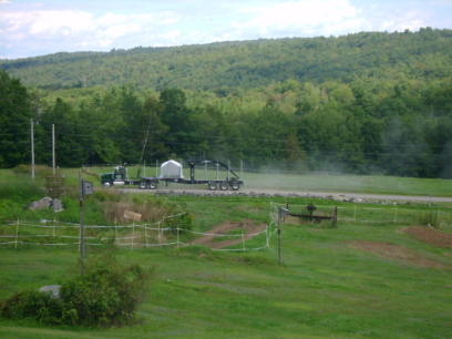 view from my house 06
log truck coming up the road
