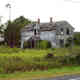 Abandoned_home_-_Sept_3,_2005_-_burned_July_2207.jpg