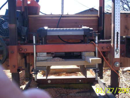 13" Rigid planer mounted to sawmill carriage
