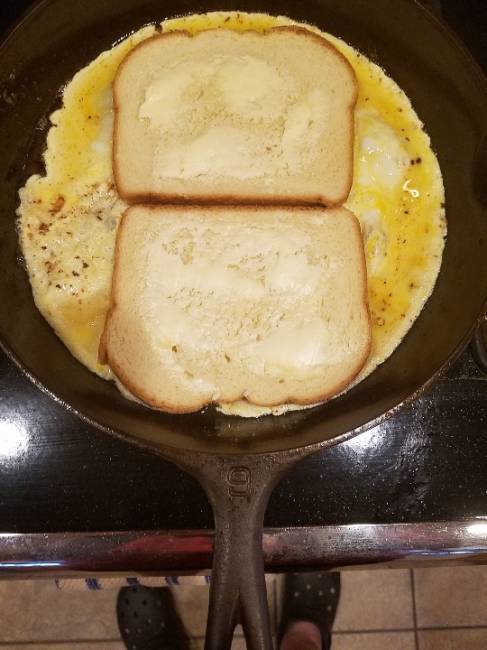 Breakfast Sandwich 
So here's something a little different in making a breakfast sandwich. First, butter one side of 2 slices of bread. In a cast iron skillet, melt a tablespoon of butter. Scramble 2 eggs and pour into the skillet. Place the 2 slices of bread butter side up, opposite each other. Let eggs cook then flip both slices over onto the butter side. Flip excess egg onto the bread. Add cheese, ham , sausage or bacon. Flip the single slice on top and grill both sides until browned and crisp.
