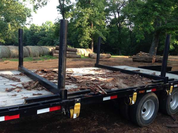 Log standards on a gooseneck trailer in Forestry and Logging